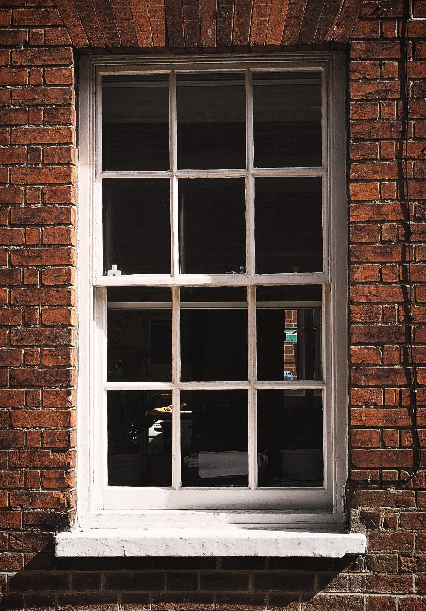 A White Wooden Framed Sash Window